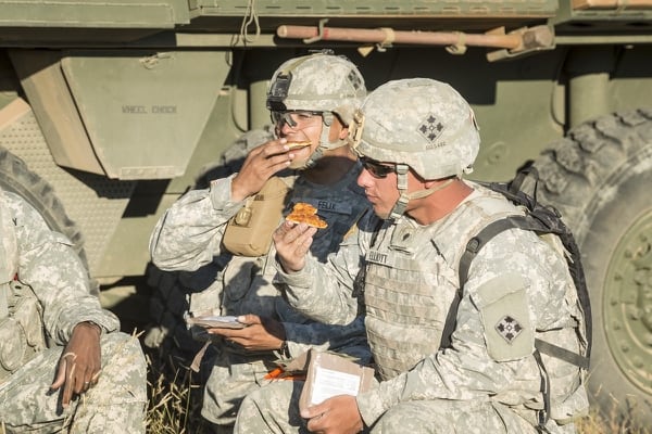 Soldiers with the 4th Infantry Division at Fort Carson, Colorado, chow down on pizza MREs. (David Kamm/U.S. Army Natick Soldier Research, Development and Engineering Center)