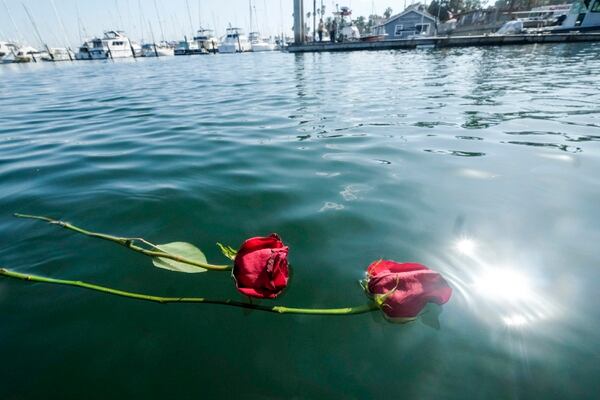Flowers float on the water near the Sea Landing at Santa Barbara Harbor in Santa Barbara, Calif., on Monday. (Ringo H.W. Chiu/AP)