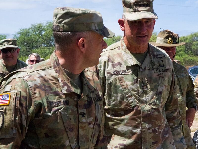 Gen. Robert Brown, right, commander of U.S. Army Pacific, speaks with Col. Chris Wendland, left, commander of the 17th Field Artillery Brigade and the Army’s Multi Domain Task Force at Pacific Missile Range Facility Barking Sands Hawaii, July 12. (Capt. Rachael Jeffcoat/Army)