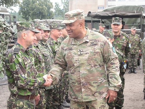 Lt. Gen. Darryl Williams, NATO LANDCOM commander, meets with Battle Group Poland Romanian soldiers at the Bemowo Piskie Training Area. The U.S.-led NATO Battle Group, including U.K. and Romanian soldiers, arrived as a deterrence force in northeast Poland in support of NATO's Enhanced Forward Presence. (Sgt. Jimmy Golden/Army)