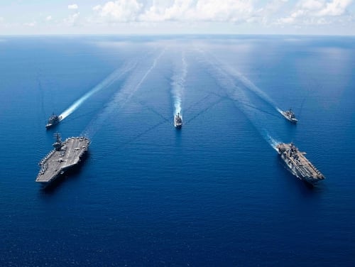 The aircraft carrier USS Ronald Reagan (CVN 76), left, and the amphibious assault ship USS Boxer (LHD 6) and ships from the Ronald Reagan Carrier Strike Group and the Boxer Amphibious Ready Group are seen in formation Oct. 6, 2019, in the South China Sea. (Mass Communication Specialist 2nd Class Erwin Jacob V. Miciano/Navy)