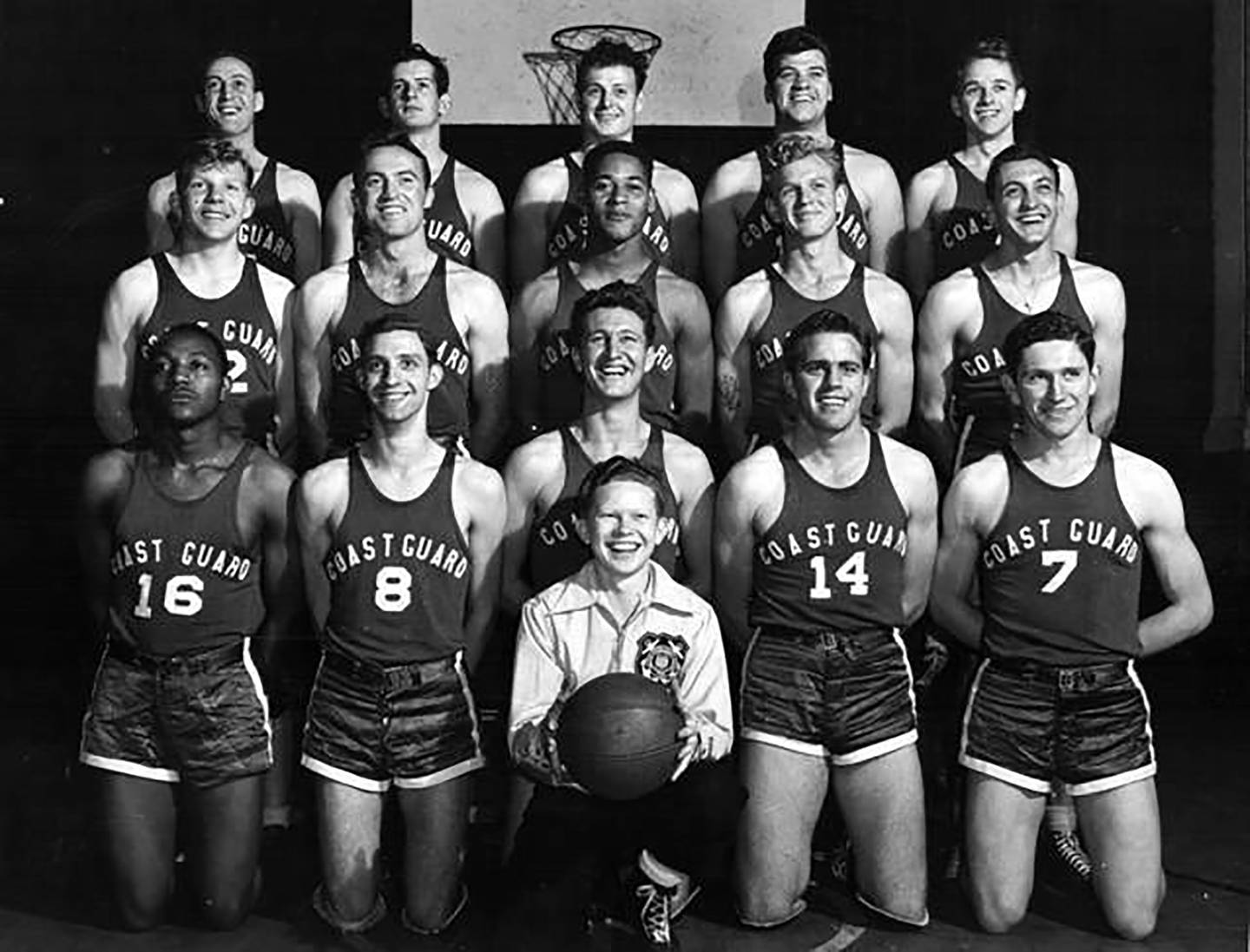 This undated photo provided by United States Coast Guard shows Emlen Tunnell, center, second from top, in a USCG basketball team photo, the first Black player inducted into the Pro Football Hall of Fame.