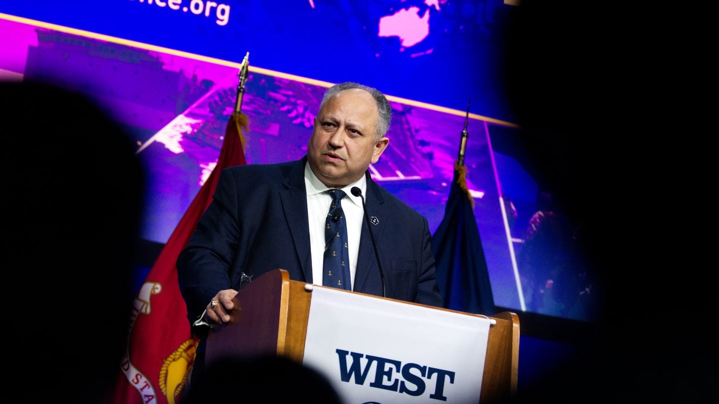 U.S. Navy Secretary Carlos Del Toro told defense contractors at West 2024 to prioritize weapons deliveries and production investments over greedy stock market maneuvering. (Colin Demarest/C4ISRNET)