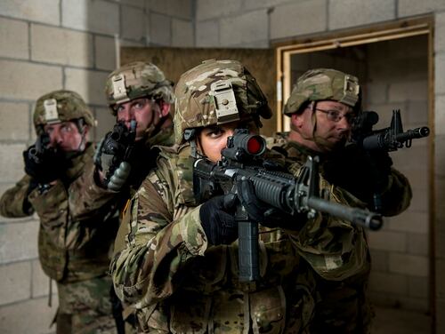 Sgt. Ian Rivera-Aponte, center, an Army Reserve sniper and infantryman with the 100th Infantry Battalion, clears a room with soldiers from the 430th Military Police Detachment during a drill at Joint Base McGuire-Dix-Lakehurst, N.J. (Master Sgt. Michel Sauret/Army)