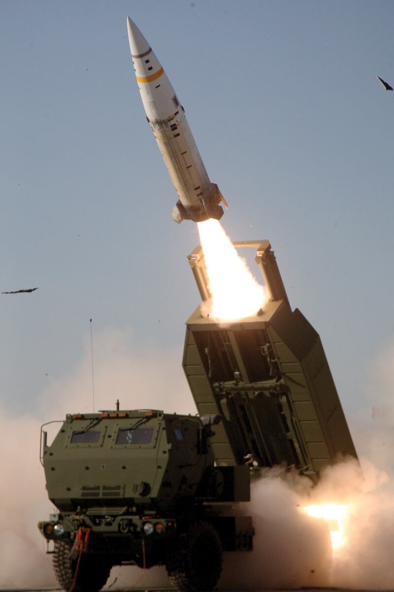 The M57A1 Army Tactical Missile System missile is fired over the cab of an M142 High Mobility Artillery Rocket System launcher. (Army)