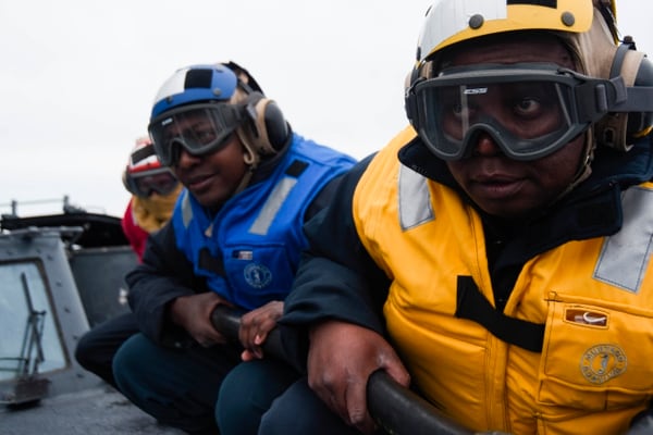 Sailors fight a simulated fire during an April 5 drill on the flight deck of the Ticonderoga-class guided-missile cruiser Normandy (CG 60). Part of the Harry S. Truman Carrier Strike Group, Normandy was underway in the Atlantic Ocean for training on sustained combat operations. (Mass Communication Specialist 3rd Class Jordan Twiss/Navy)