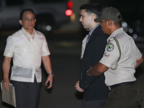 Philippine Bureau of Corrections personnel escort U.S. Marine Lance Corporal Joseph Scott Pemberton (C), after he was found guilty by trial court of killing Jennifer Laude, a transgender woman, upon arrival in a detention facility at Camp Aguinaldo in Quezon city, Metro Manila, December 1, 2015. REUTERS/Bullit Marquez/Pool