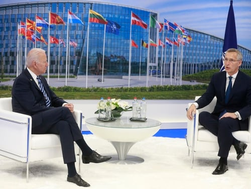 NATO Secretary General Jens Stoltenberg, right, speaks with U.S. President Joe Biden during a bilateral meeting on the sidelines of a NATO summit in Brussels on June 14, 2021. (Stephanie Lecocq/AP)