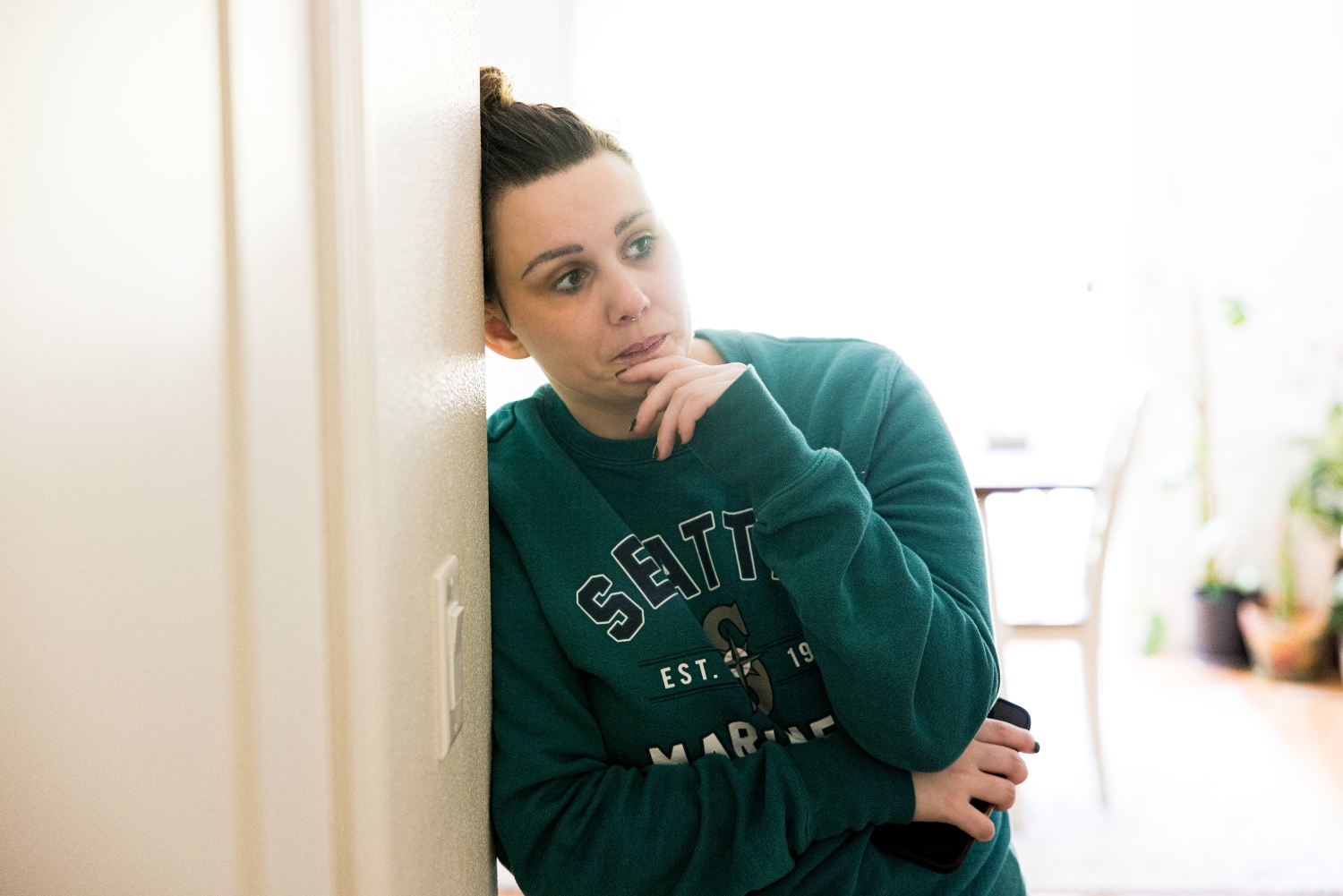 Amanda Klinksiek pauses while discussing the problems with mold that her family has dealt with while living in their town house on Joint Base Lewis-McChord.