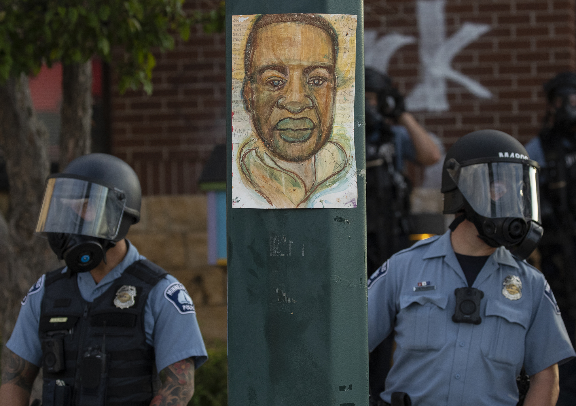 Minnesota police stand outside the department's 3rd Precinct on Wednesday, May 27, 2020, in Minneapolis.